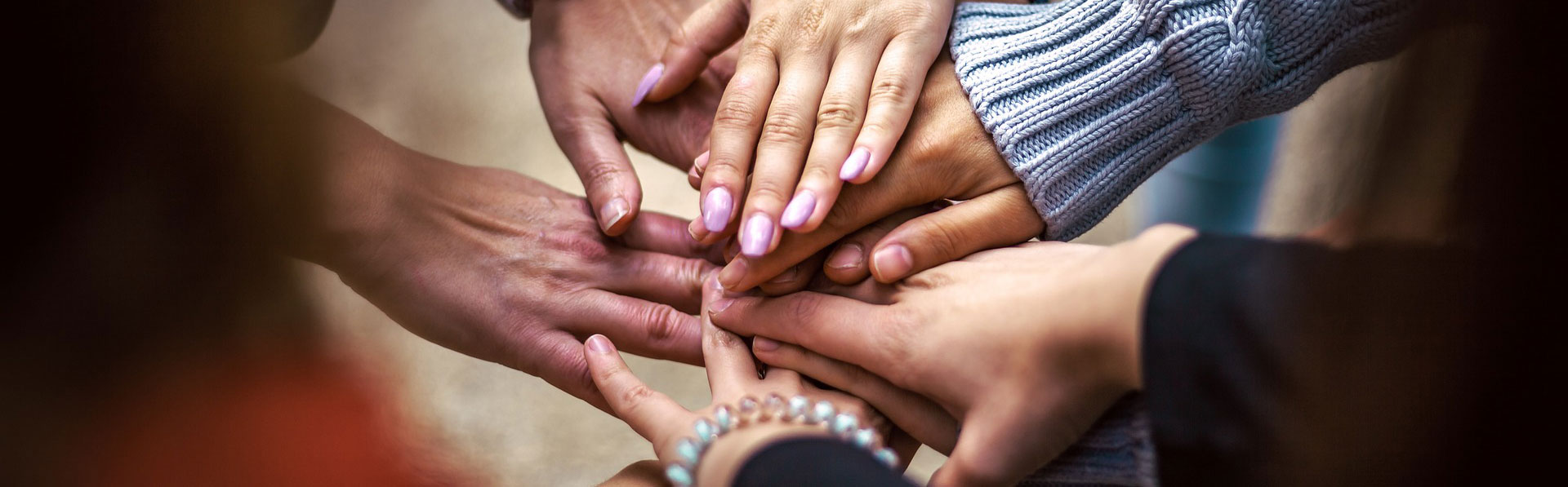 Community - hands in huddle