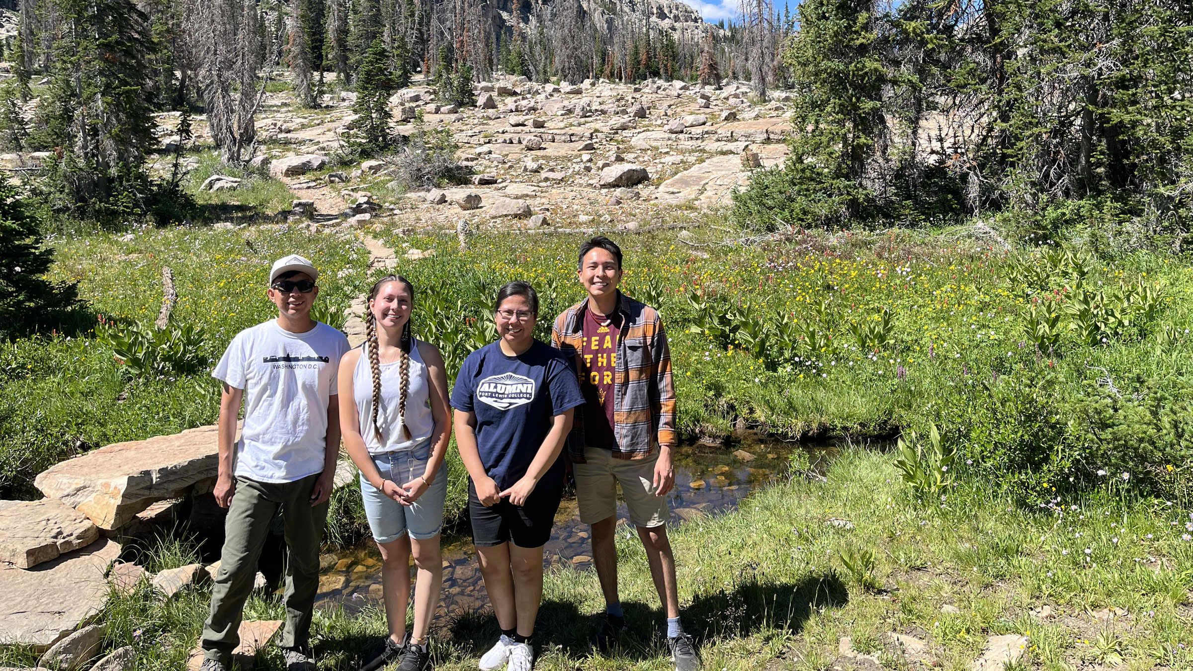 NARI participants in front of mountain stream
