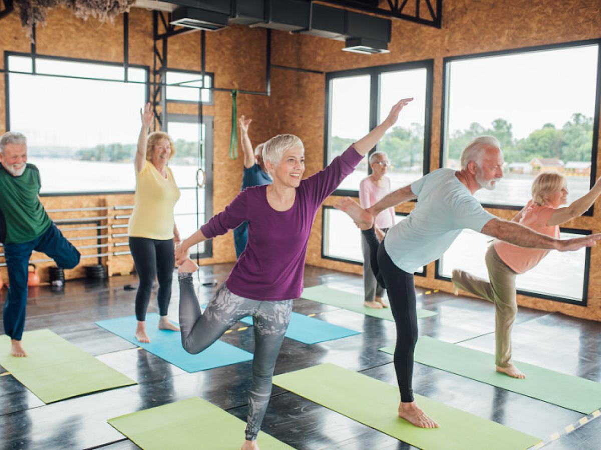 happy "mature" people doing yoga