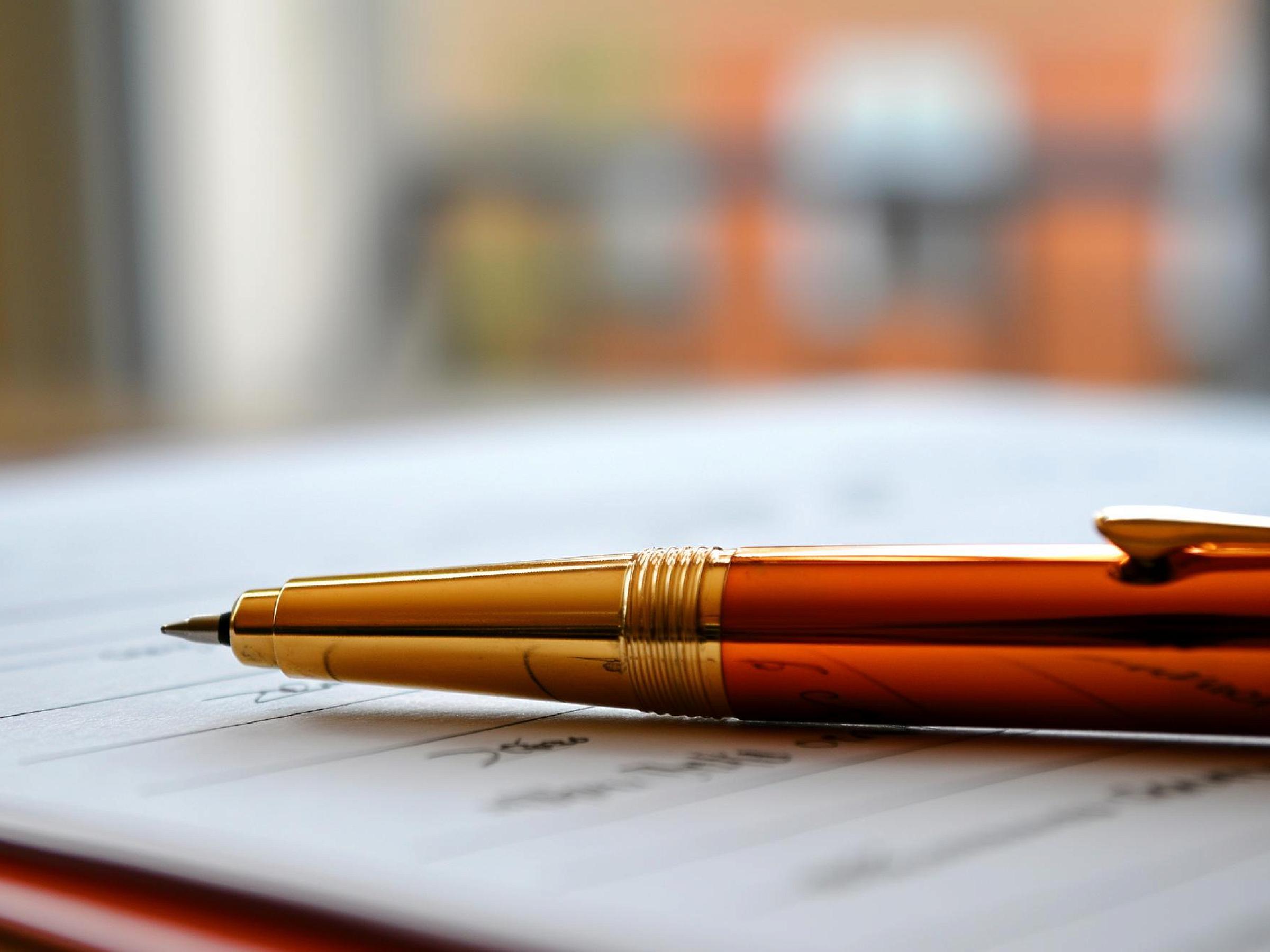 pen resting on paper document