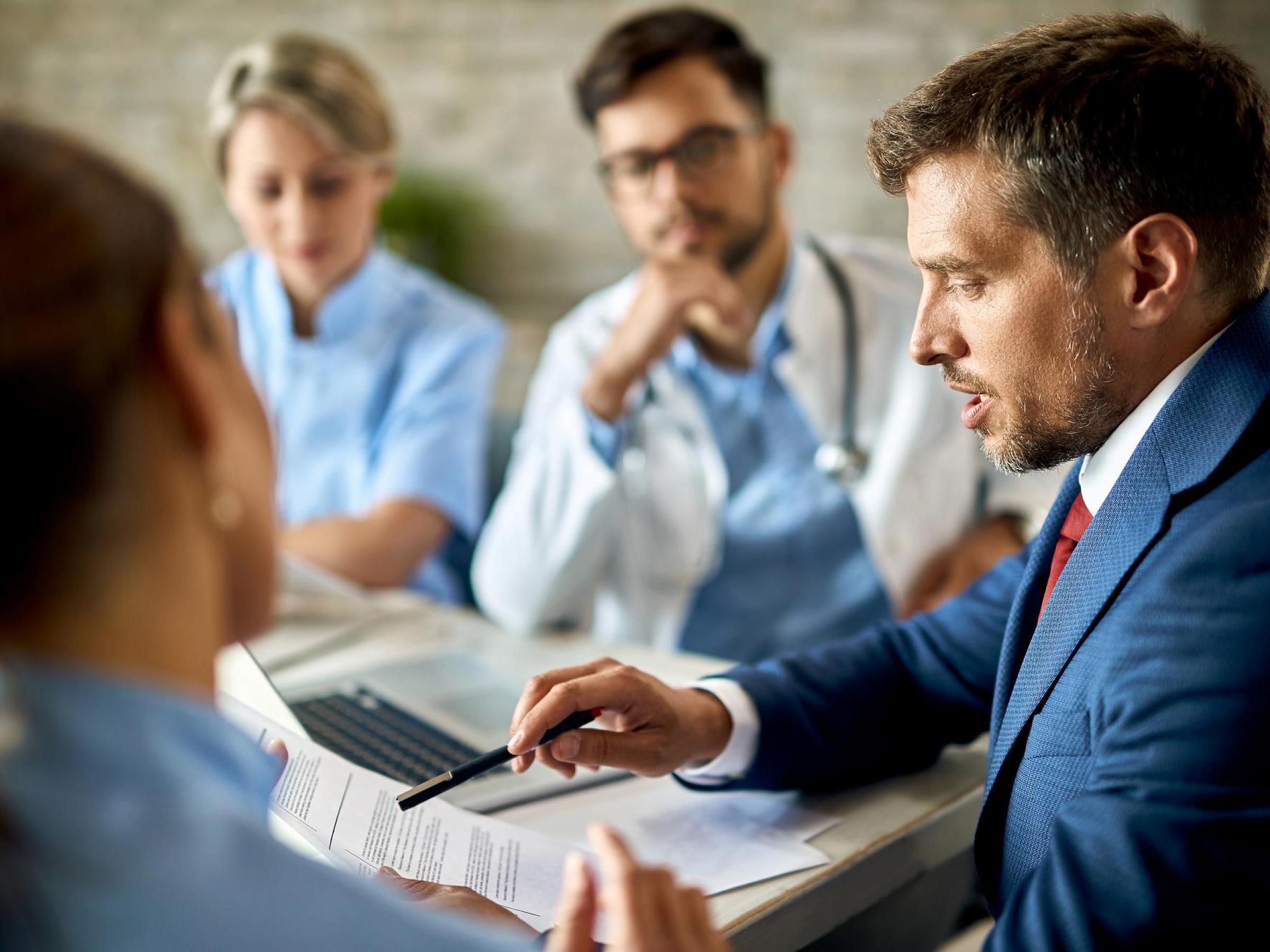 businessman in a meeting with healthcare professionals